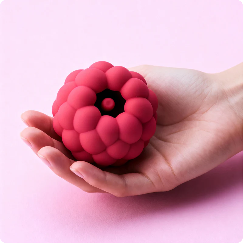 Hello Nancy raspberry-form product held in a hand on a pink ground
